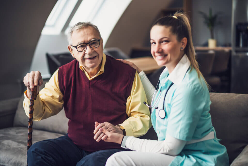 Senior man assisted by a nurse in a luxury senior assisted living facility in Tarzana
