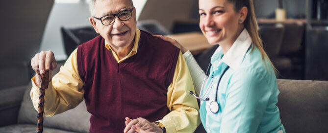 Senior man assisted by a nurse in a luxury senior assisted living facility in Tarzana