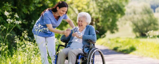 Senior resident in a serene outdoor garden at a luxury senior living facility in West Tarzana.